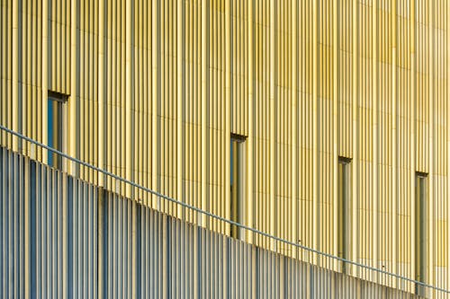 A building with a metal facade and a railing