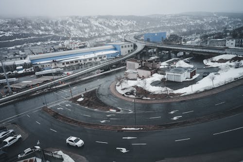 A view of a highway with cars and snow