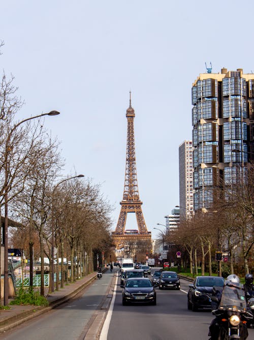 A view of the eiffel tower from a street in paris