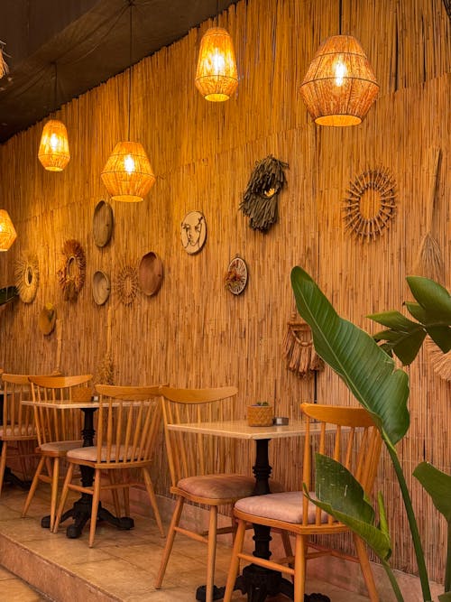 A restaurant with wooden tables and chairs