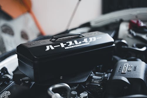 A black and white car engine with a black box