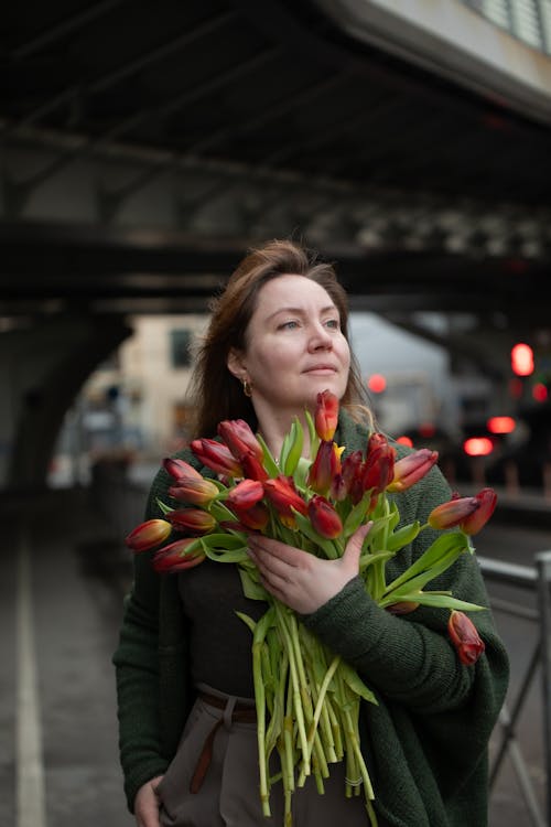Portrait of Woman with Red Tulips