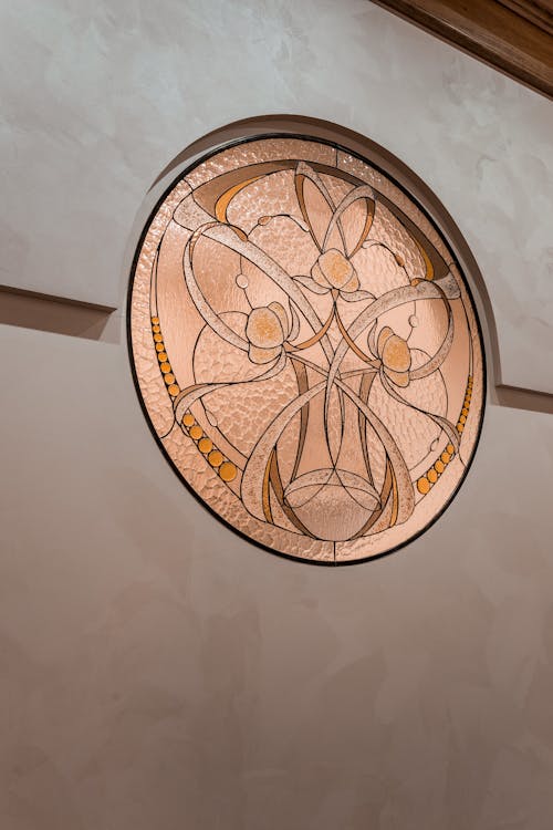 A circular stained glass window on the wall