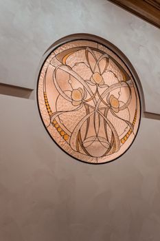 Beautiful Art Nouveau stained glass window with intricate patterns and warm tones.. beautiful, nouveau, stained