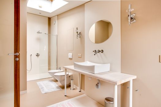 Sleek and contemporary bathroom design featuring a walk-in shower and stylish fixtures.
