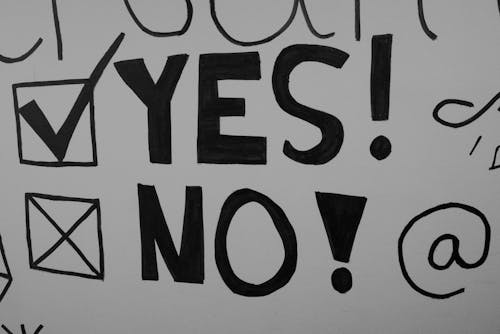 A black and white drawing of a yes and no sign