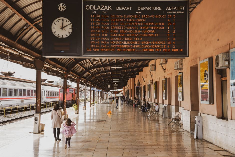 train station departure board rain