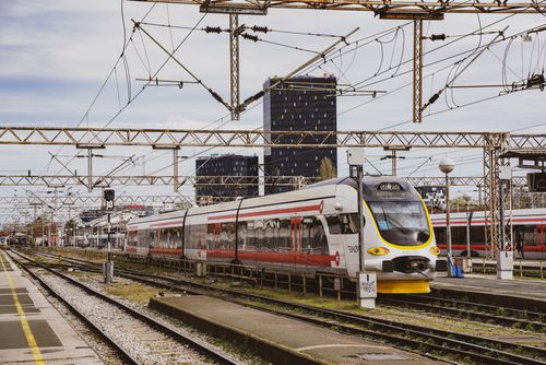 Free A sleek passenger train at Zagreb railway station under an intricate network of power lines. Stock Photo