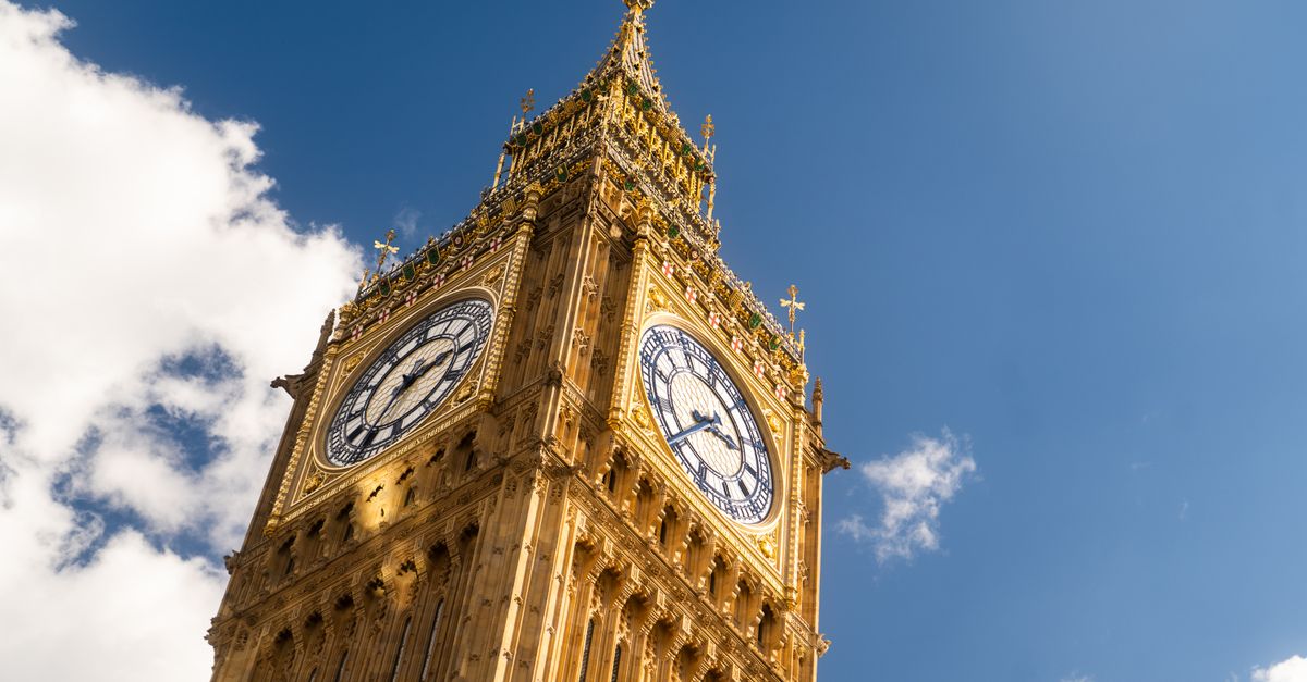 The iconic Big Ben clock tower in London against a clear blue sky.