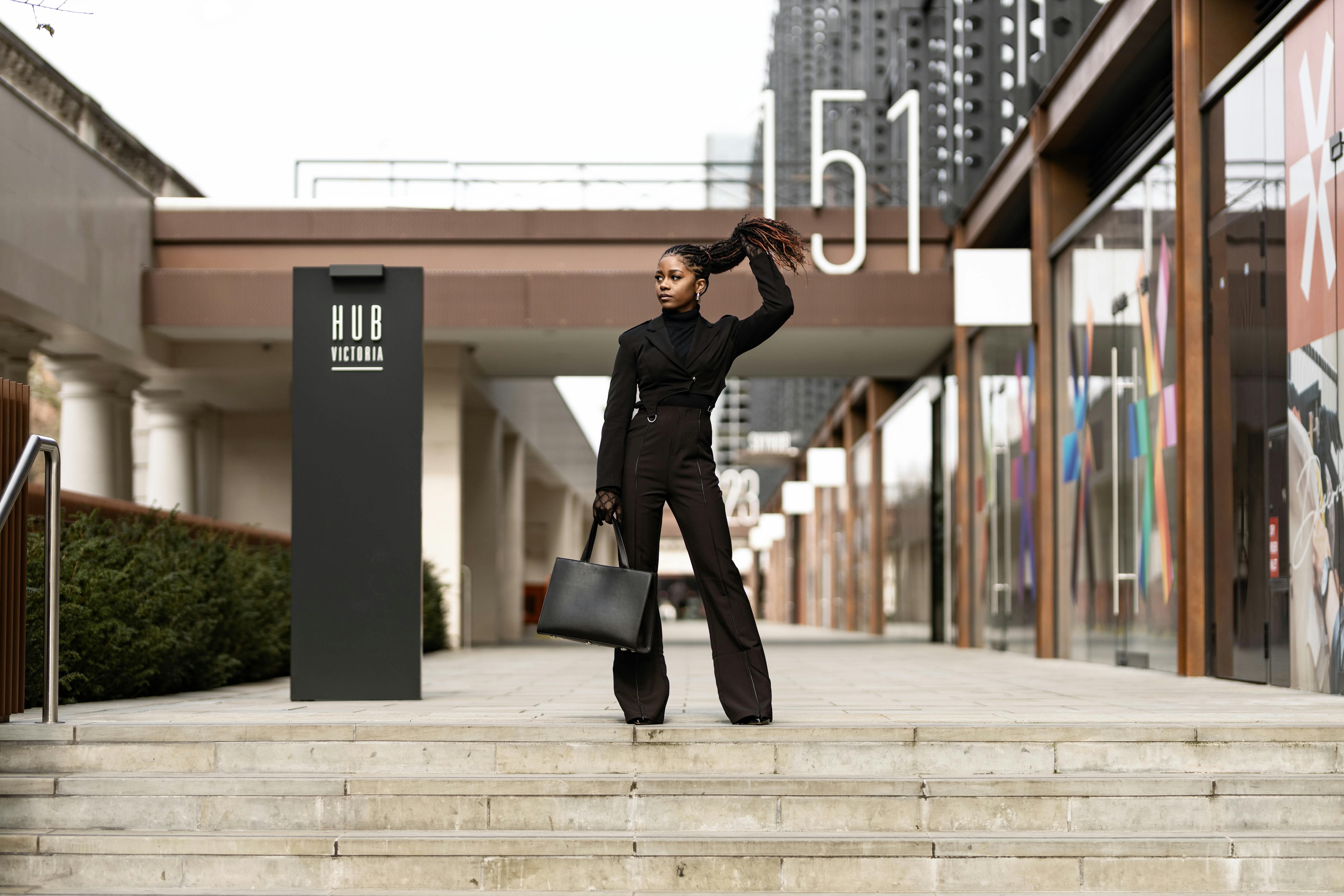 Woman in Black Clothes and with Bag