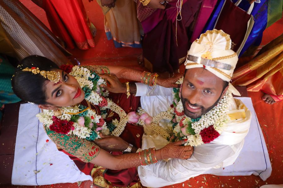 Bride and groom exchanging garlands at the muhurtham