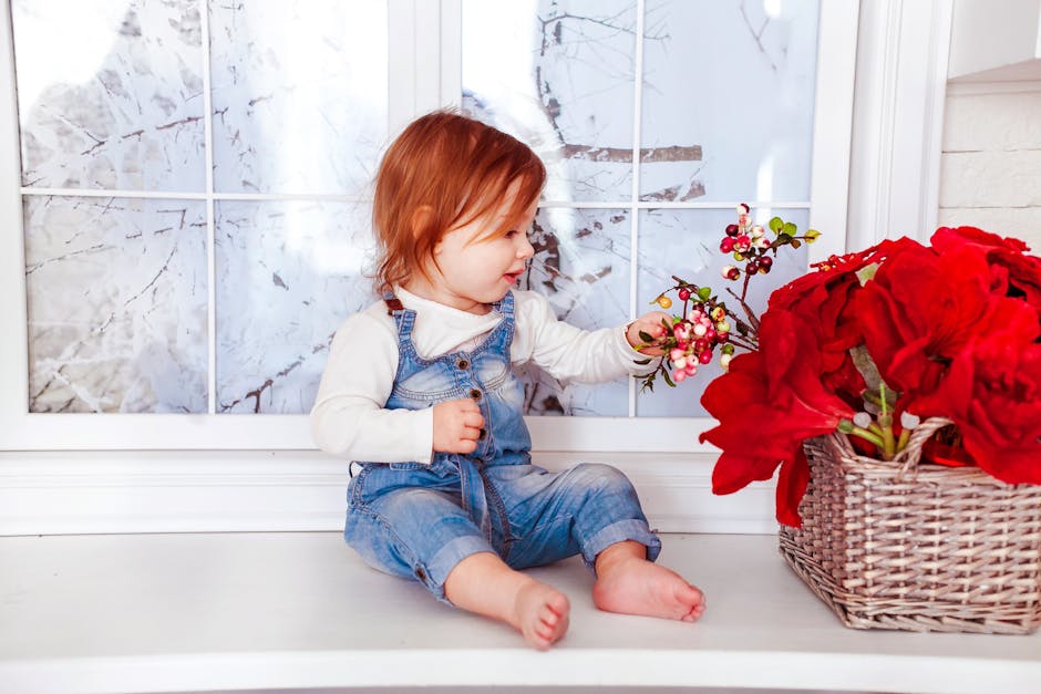 Kid's Blue Denim Jumper Sitting on White Wooden Side Table