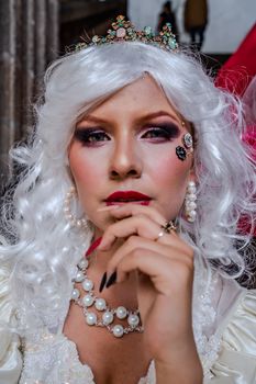 Stunning portrait of a woman with white hair and elegant makeup, wearing pearls and a tiara, exuding glamour and fantasy.