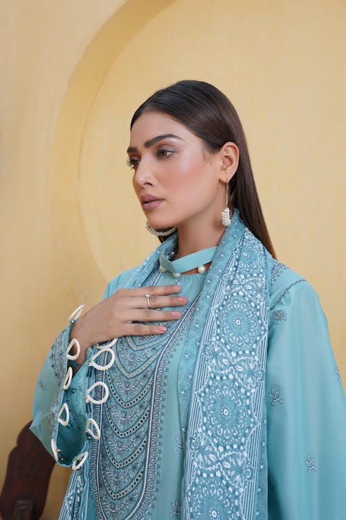 Model in Embroidered Blue Shalwar Kameez Dress and a Scarf