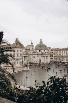 Captivating view of Piazza del Popolo with historic architecture and lively atmosphere in Rome.