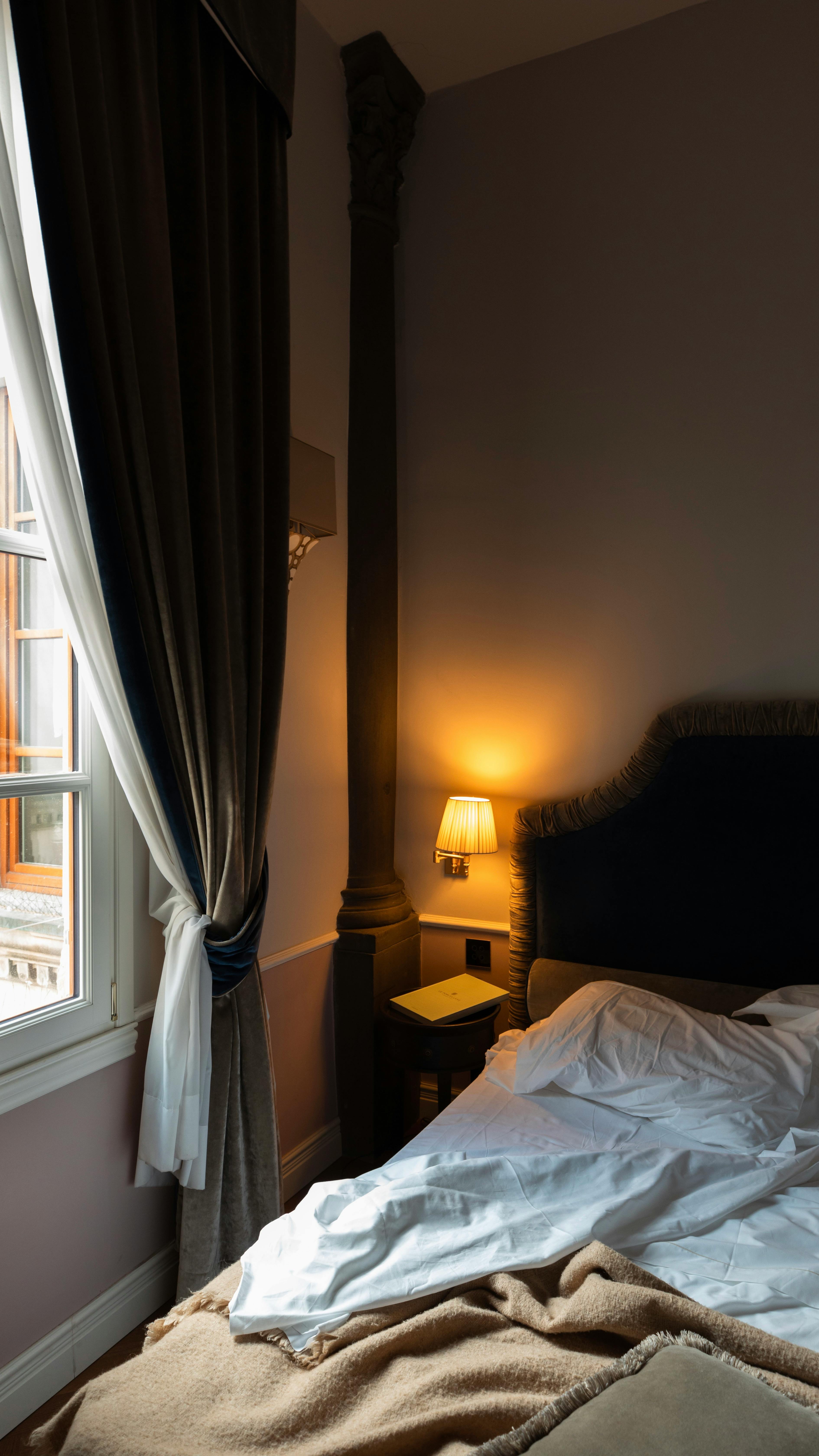 Warm and inviting bedroom with elegant decor and soft ambient lighting