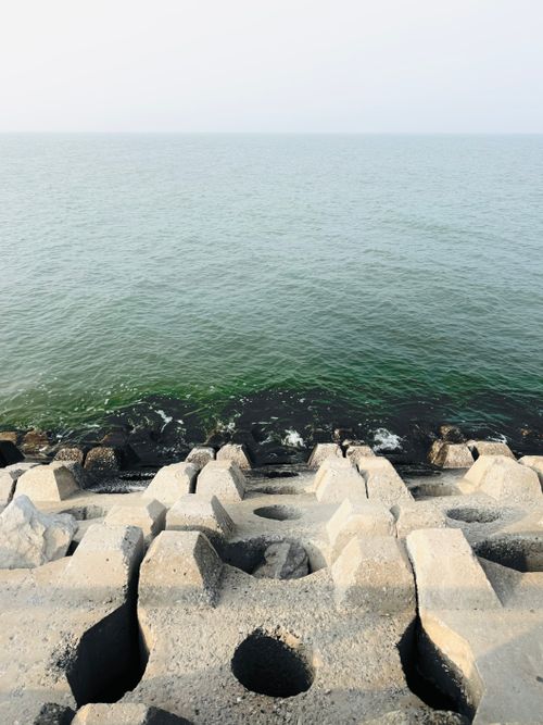 Free Concrete barriers line the Baoshui District coastline in Tianjin, China, under a clear sky. Stock Photo