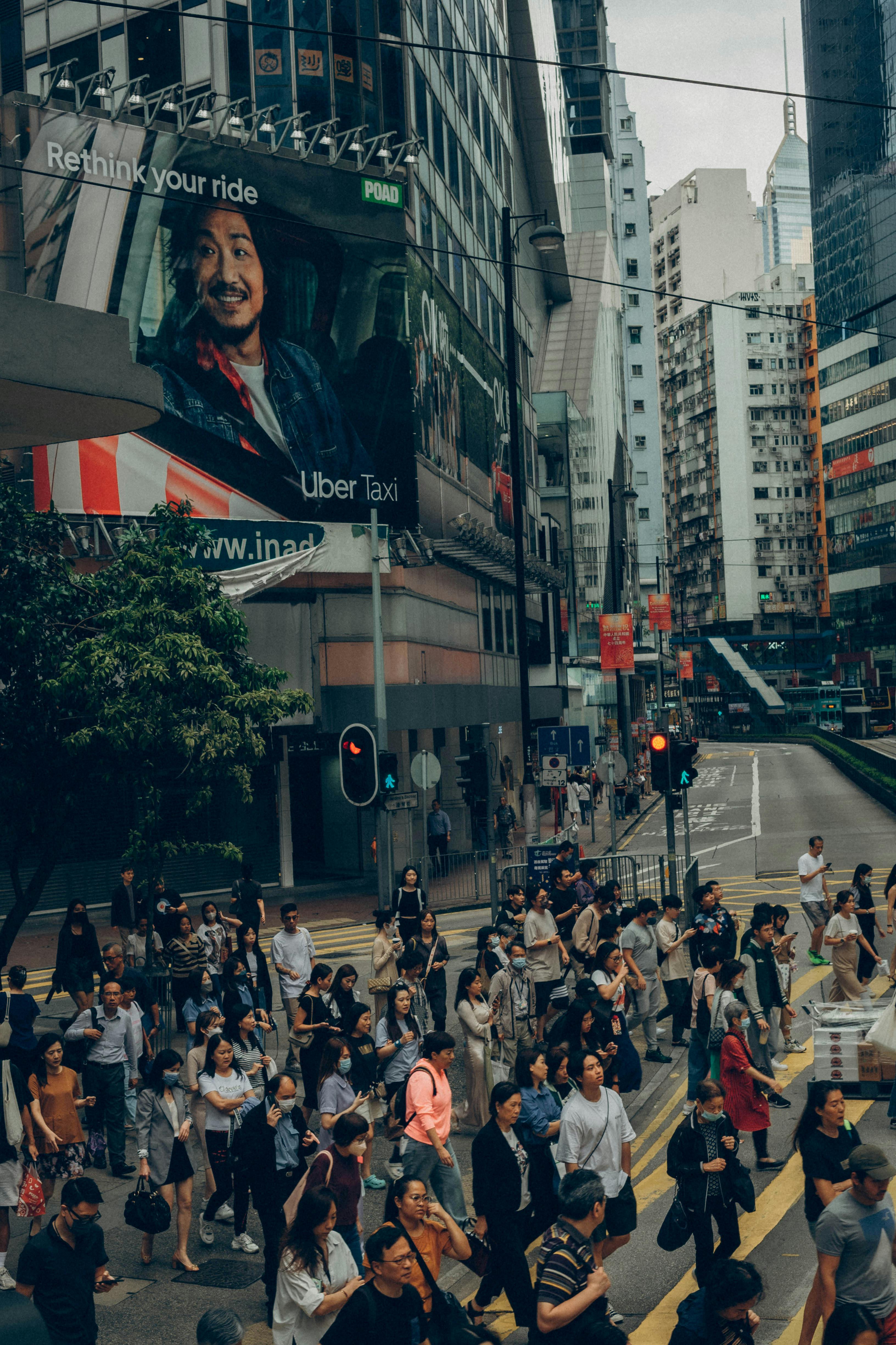 crowd crossing street in hong kong