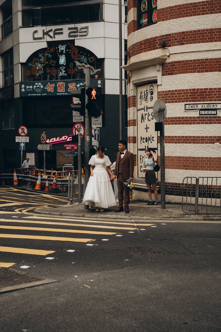 Wedding Couple On A Pedestrian Crossing 