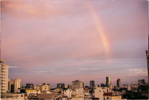 A rainbow is seen over the city skyline