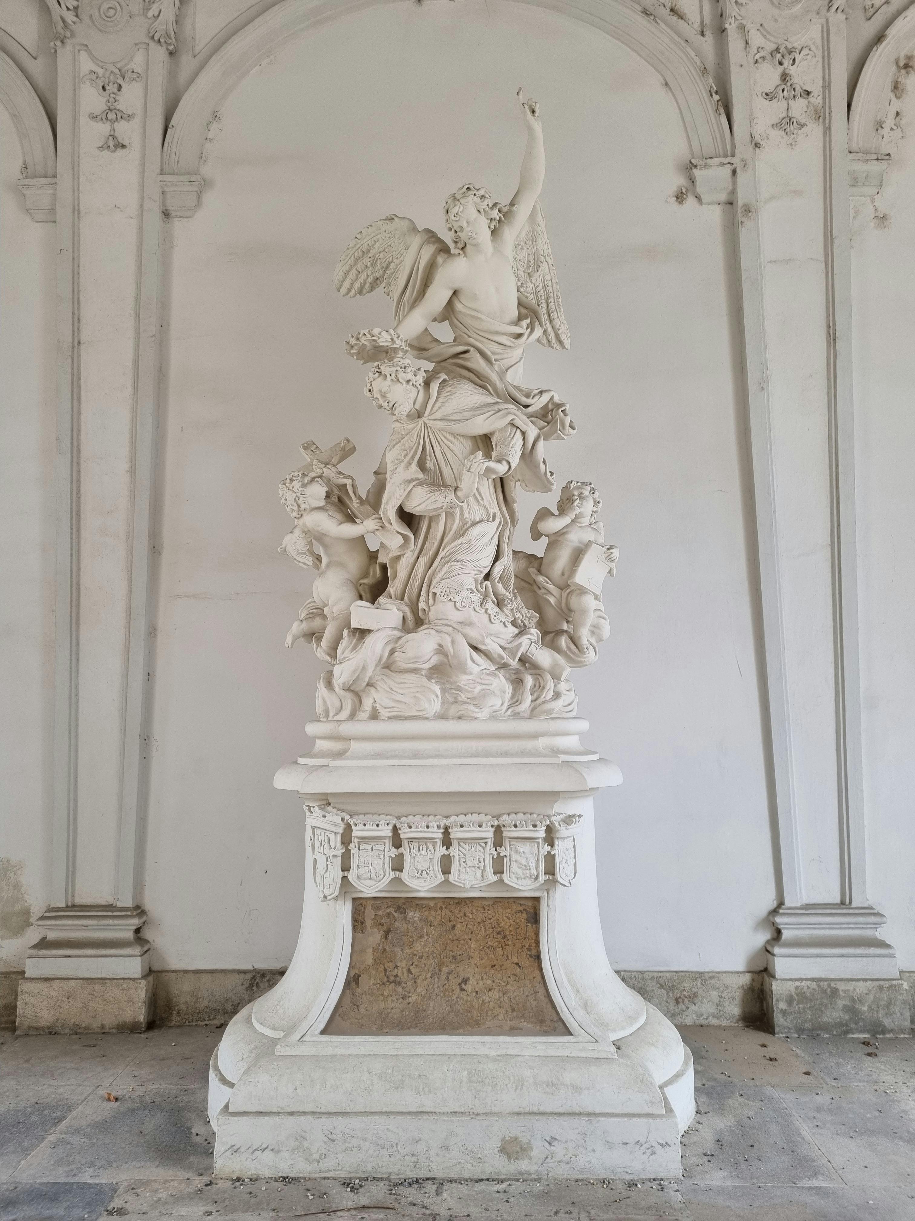 Intricate white marble statue in Belvedere Palace, Vienna, Austria.