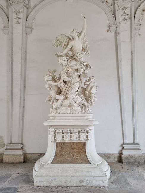 Intricate white marble statue in Belvedere Palace, Vienna, Austria.