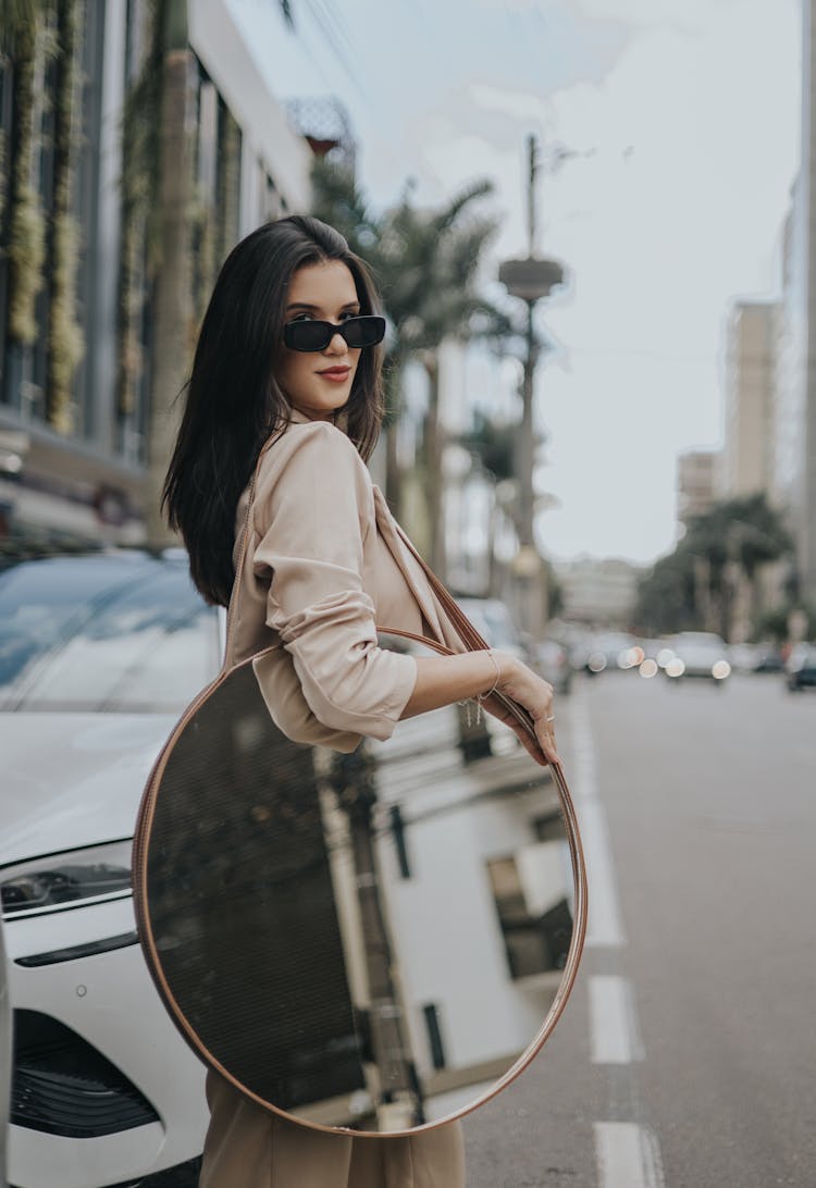 Woman With Mirror On Street