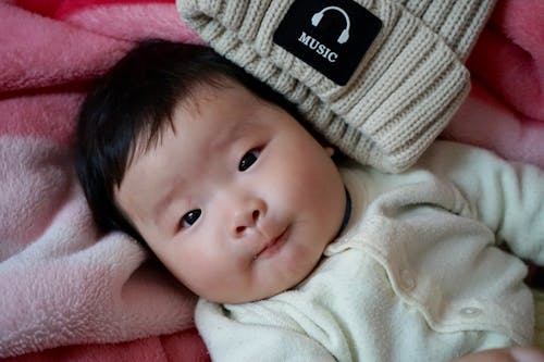 Free Baby Lies on Pink Towel Stock Photo