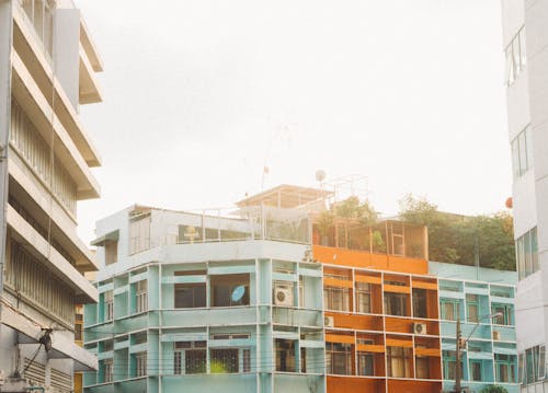 Teal Concrete Building Near Trees