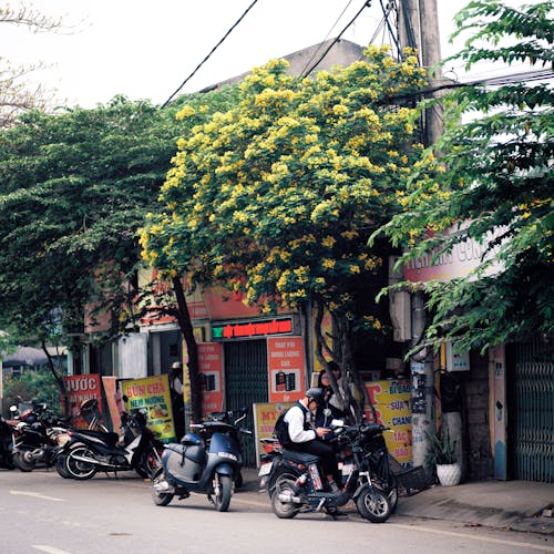 A street with a lot of motorcycles and cars