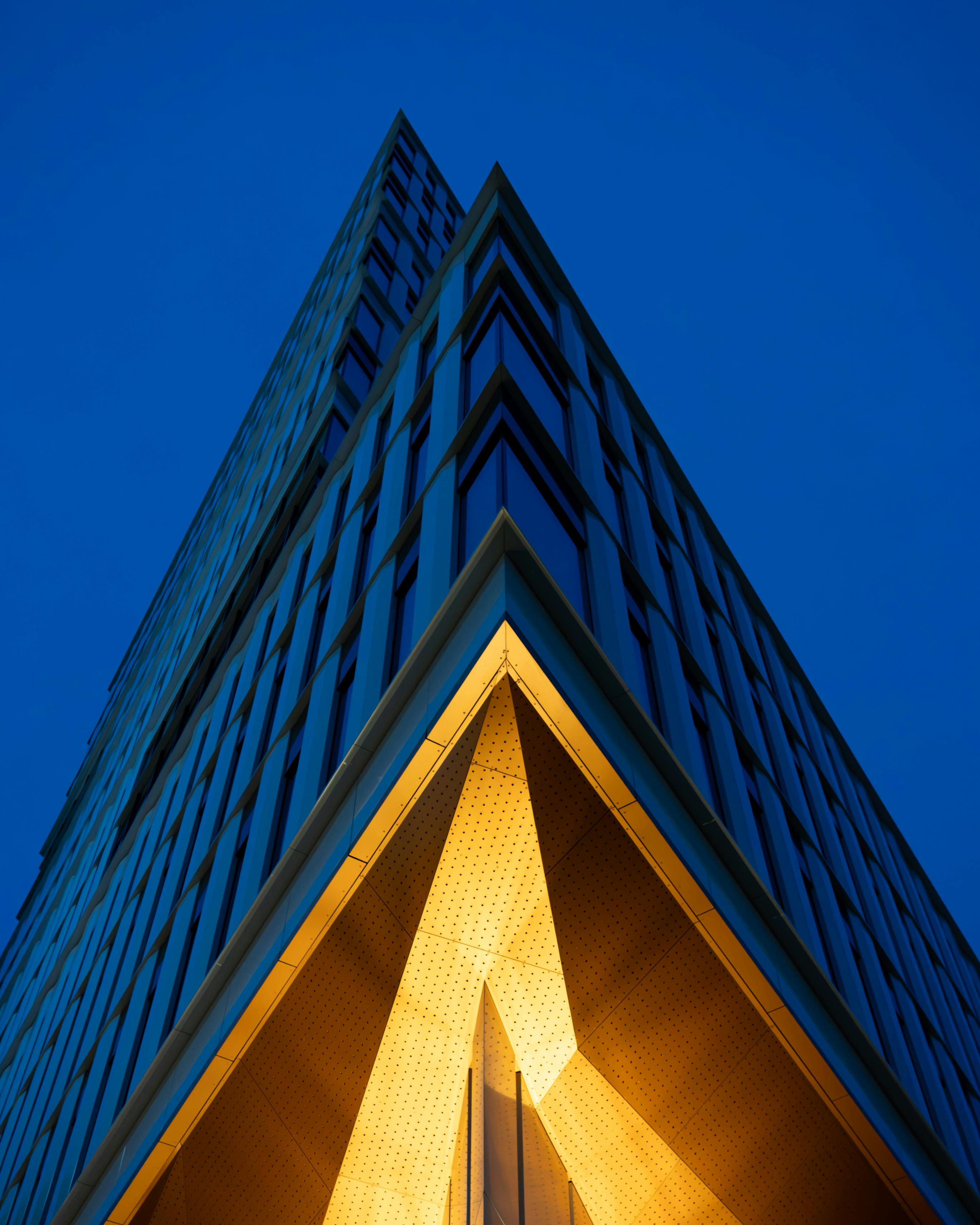 Free Striking low angle shot of modern architecture in Wrocław during evening. Stock Photo