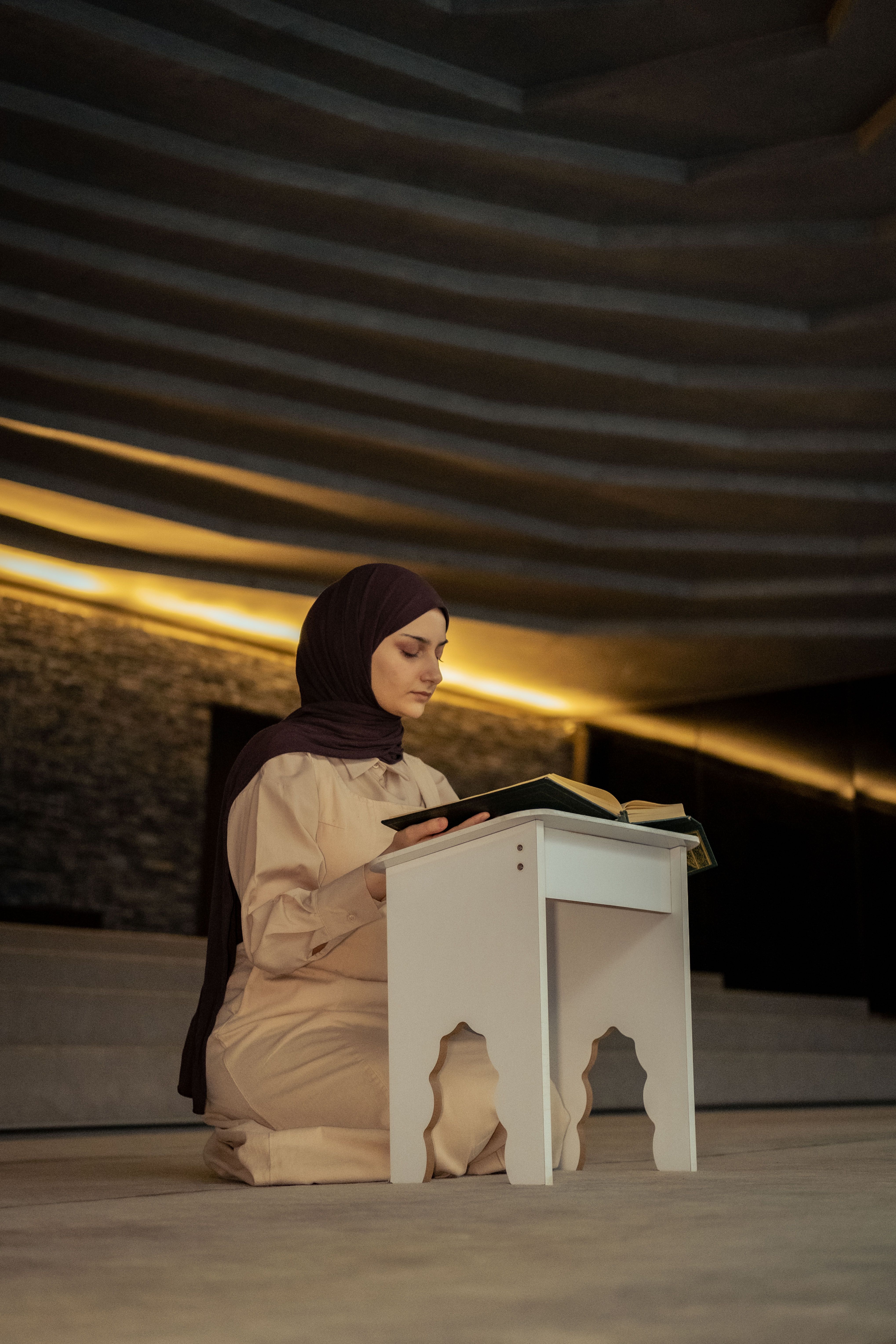 Woman reading Quran in a peaceful setting