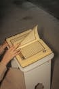 Close-up of a Person Turning the Page of the Quran