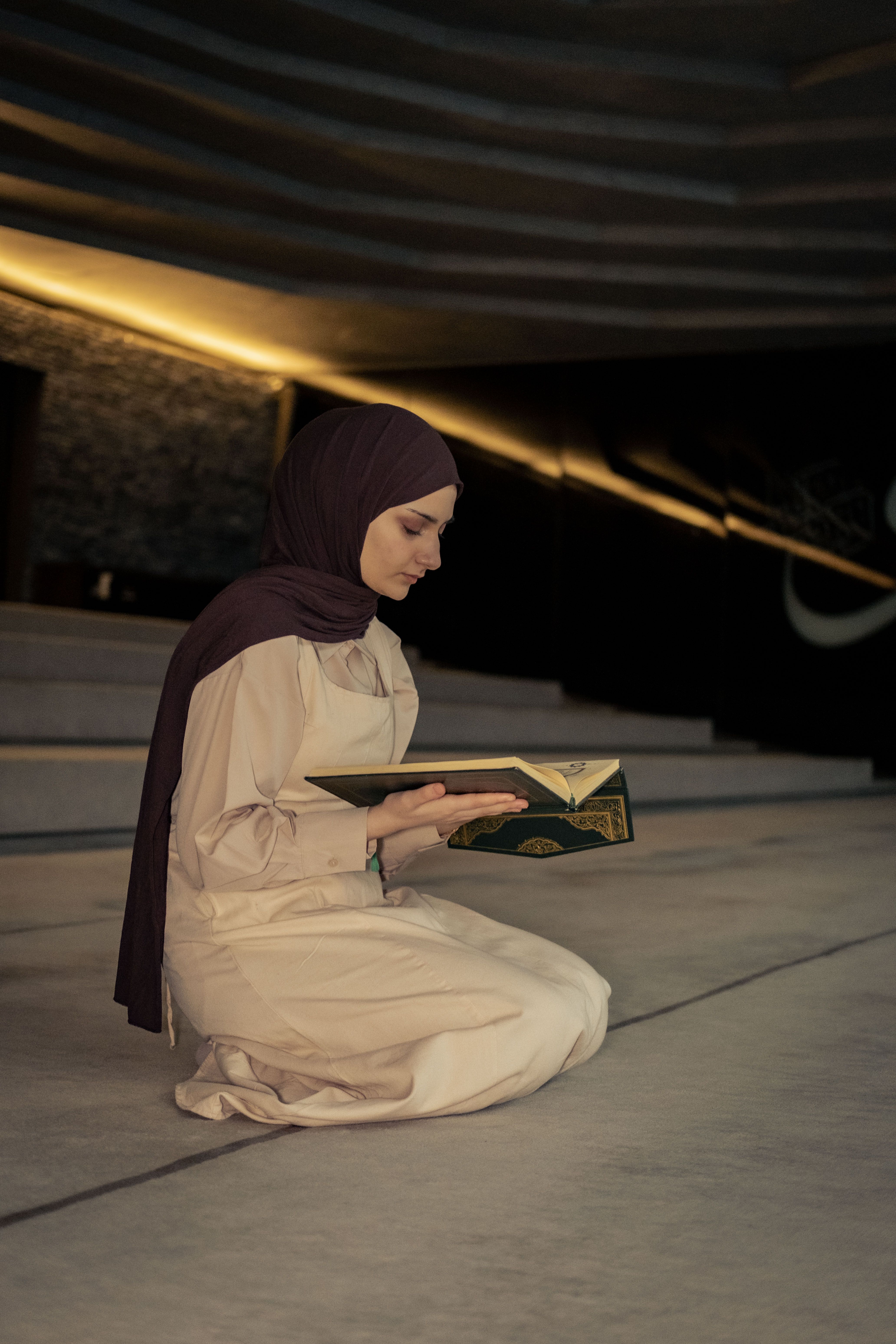 Young Muslim woman studying Quran