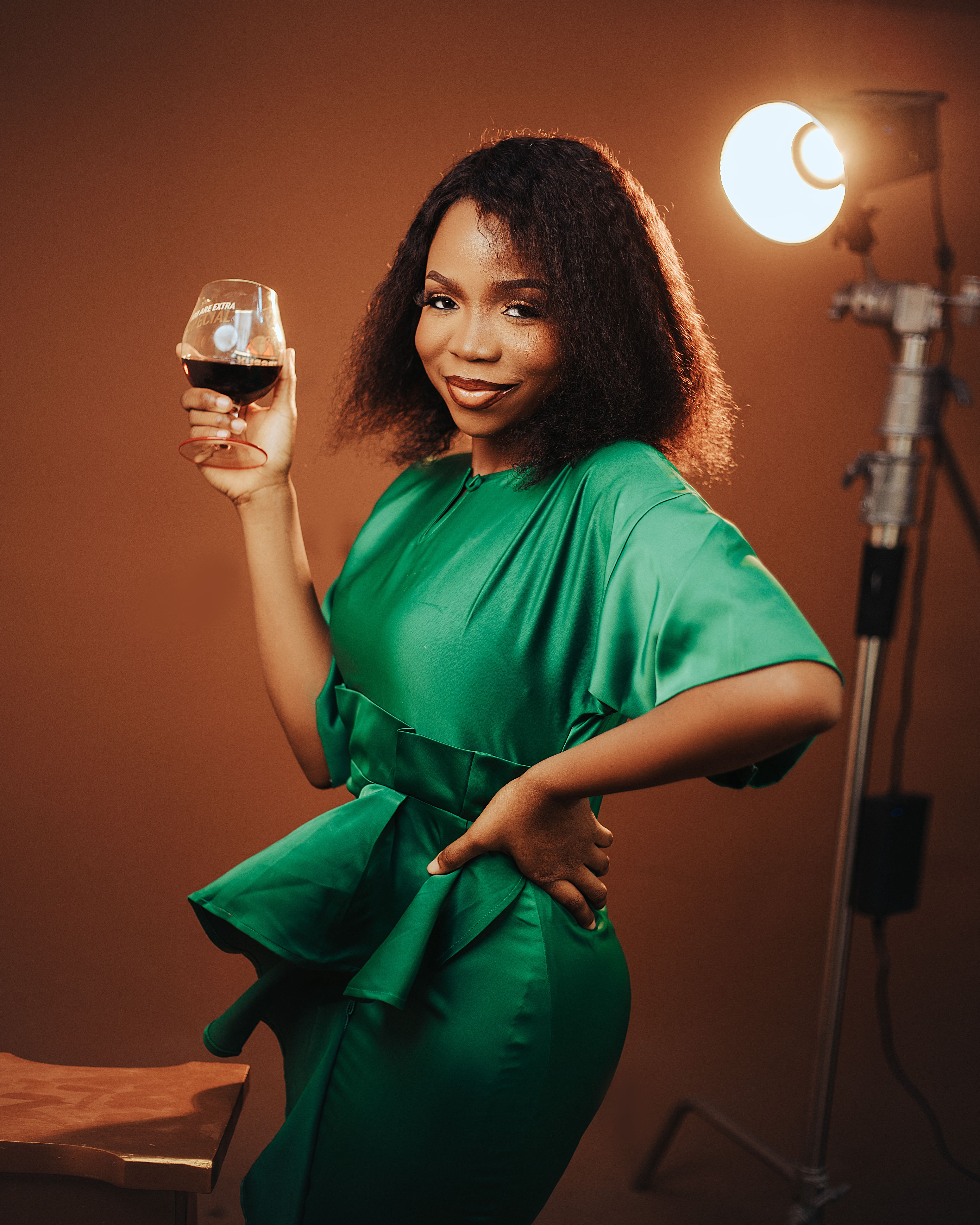 Elegant Woman Wearing a Green Dress Smiling · Free Stock Photo