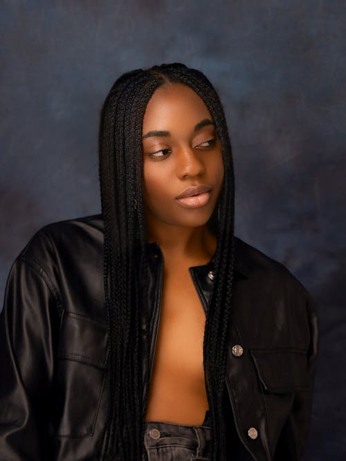 Free A woman with long braids posing for a photo Stock Photo