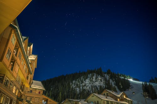 A night sky with stars above a ski resort