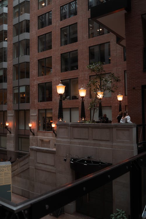 A couple of people standing on a balcony