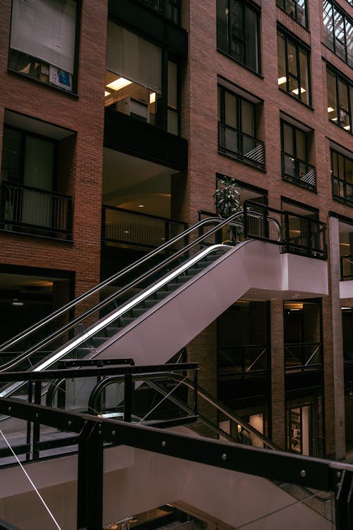 A man walking down a set of stairs in a building