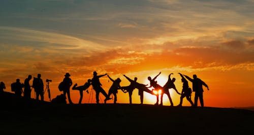 Silhouette of People during Golden Hour