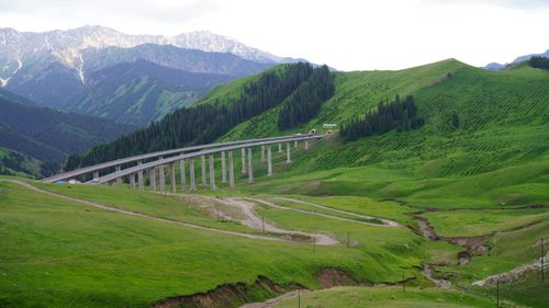 Free A picturesque mountain landscape with a bridge in Ili Kazakh, Xinjiang, China. Stock Photo