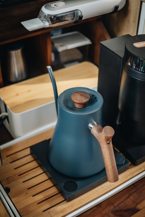 A coffee maker sits on top of a wooden counter