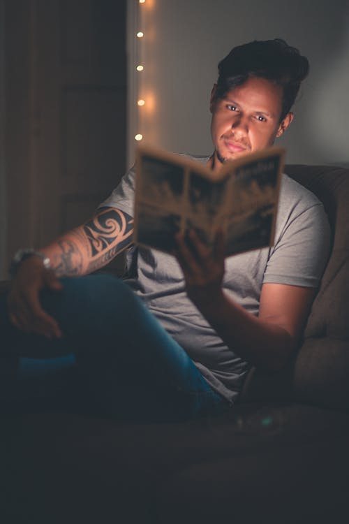 Free Man Reading A Book Stock Photo