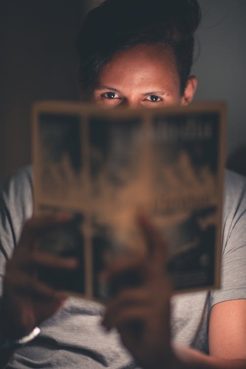 Man Holding Paper
