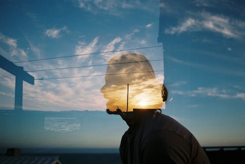 Double exposure of man and landscape