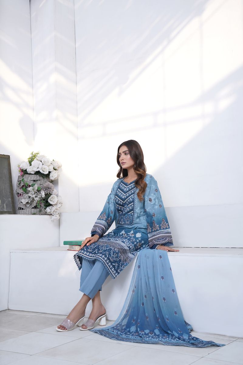 Model wearing an embroidered kurta and dupatta set