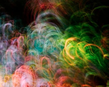 Vibrant swirling colors and light patterns create an abstract art piece.