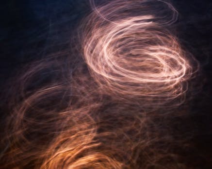 A mesmerizing abstract photo capturing warm, swirling light patterns.