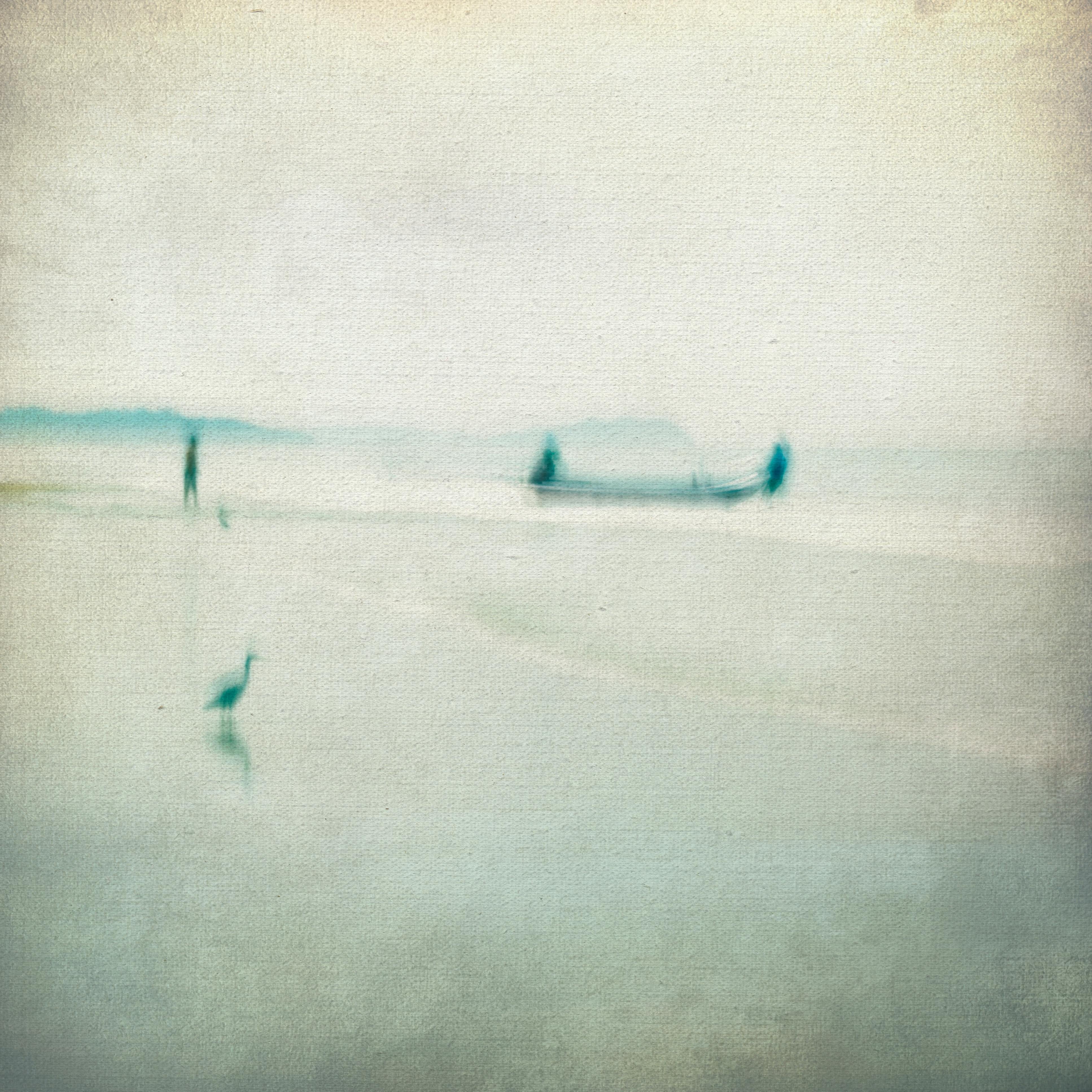 Ethereal impressionistic seascape with boat and bird at dawn. Serene and abstract atmosphere.