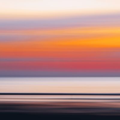 Vibrant Sunset Over Calm Ocean Waves · Free Stock Photo